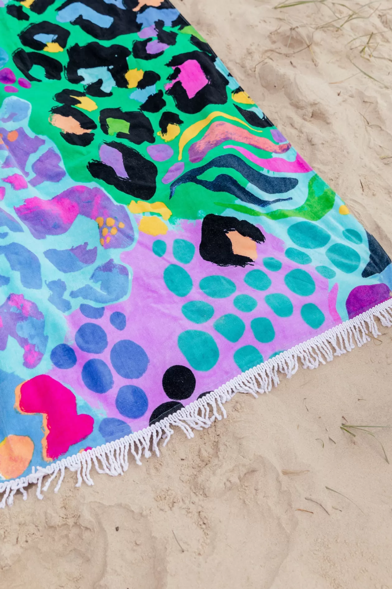 Proud Poppy Clothing Beach Towel in Electric Leopard by Kasey Rainbow